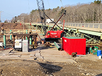 Closer view of temporary pile driving operation for the temporary Station 46 Bridge, looking south towards George Wright Rd. from existing Station 46 Bridge.